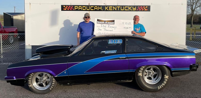 It was a productive end to the weekend for Litchfield racer Phil Bryant on Sunday, April 10. Bryant, right, pictured with his son Dustin in victory lane, won the Quick 16 race at Beacon Dragway in Paducah during the track&rsquo;s Beacon Bucks big money race. The win scored Bryant a $1,000 pay day.