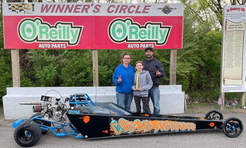 Addy Beal, pictured with her parents, Angie and Andy Beal of Farmersville, took second in her 2022 junior dragster opener at Coles County Dragway on Sunday, May 1, in Charleston.