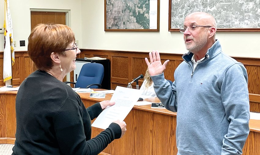 Litchfield City Clerk Carol Burke administers the oath of office to Dan Newkirk, who was appointed as the newest member of the Litchfield City Council on Thursday, May 5. Newkirk replaces Mark Brown as an alderman for ward two, after Brown resigned last month after seven years on the council.
