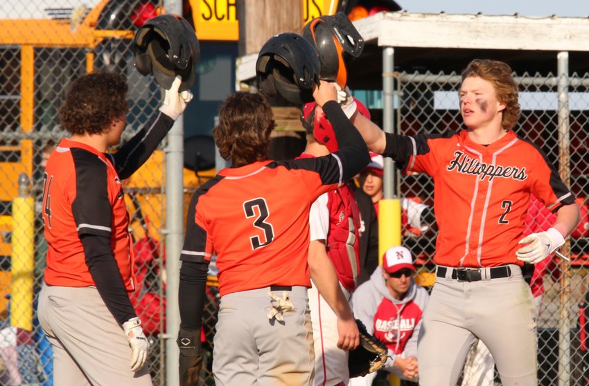 From the left, Deklan Riggs, Dillon Smail and Drake Vogel celebrate at home plate after Vogel's home run in the championship game of the Montgomery County Tournament in Raymond. The trio were three of the four Hillsboro batters who hit over .300 for the year, with sophomore Ketch Mills the outlier with a team-best average of .424.