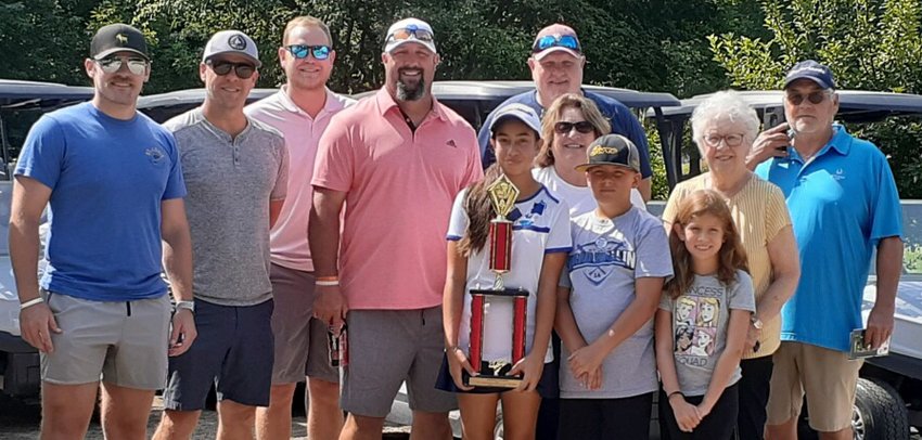 While her parents, Tyson and Carmen Snyder, weren&rsquo;t able to make the trip from Orlando, FL, Alexandra Snyder still had quite the cheering section when she won the Drysdale Junior Golf Tournament on Thursday, July 14. From the left are Reese Snyder, Darren Lucas, Tate Snyder, Ryan Patterson, Alexandra Snyder, Kendall Snyder, Christa Snyder, Corbin Rovey, Delilah Mendoza, Darlene Fuchs and Randy Snyder.