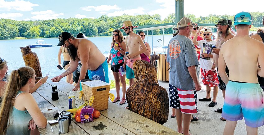 Participants in the Glenn Shoals Lake Club Aqua Run line up to roll at the first stop at the North Marina, hosted by Hubbart Wood and Brett and Courtney Bell.