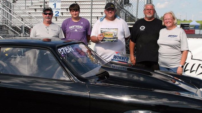 On Aug. 6, Litchfield racer Corey Wood picked up a win in the pro class at the Ed Dixon&rsquo;s Race For The Gold at World Wide Technology Raceway in Madison. Pictured in Victory Lane are Roger Burdell, Kenden Longwell, Corey Wood and Phil and Sharon Bryant, with Burdell and Bryant also racing on Saturday.