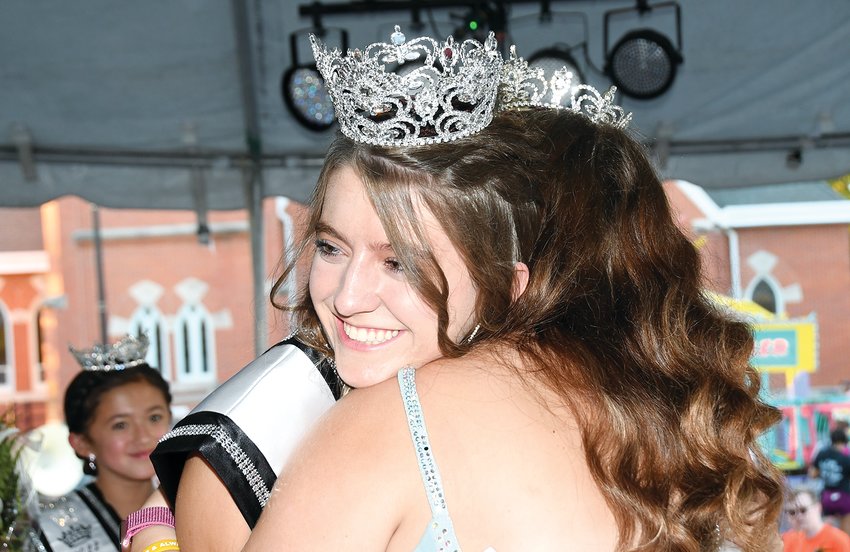 Shortly after being named as the 2022 Old Settlers Queen, Marah Huber gets a hug from retiring queen, 2021 Old Settlers Queen Jade Christian. This year's queen's parade was held through downtown Hillsboro on Wednesday evening, Aug. 10, and the coronation took place on the stage.