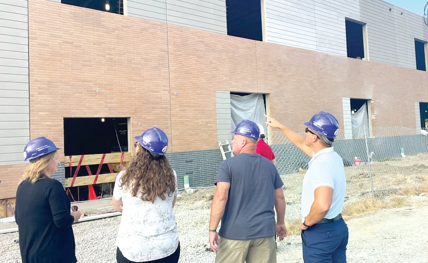 Litchfield School Board members, from the left, Julie Abel, Valerie Cain, Ron Anglin and Jimmy Gorowski, examine the south side walls of the new State Street elementary school project during their regular school board meeting on Tuesday evening, Aug. 16.