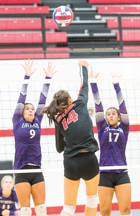 Litchfield's Kendall Stewart (#9) and Gina Painter (#17) go up for a block against Nokomis freshman Addison Glenn during the Redskins' home match on Thursday, Aug. 25. Glenn had three kills in the game as Nokomis rallied back from a 27-25 first set loss to win the next two, 25-18, 25-21.