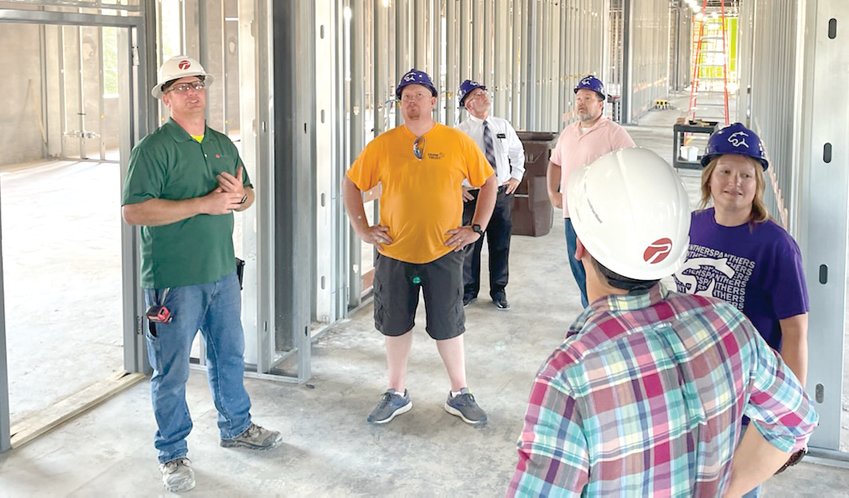 Eric Kohnen of Poettker Construction, at left, gives a progress tour of the new State Street elementary school project to Litchfield School Board members during their regular meeting on Tuesday evening, Sept. 13. Pictured above, the second floor classrooms are starting to take shape. The project is expected to be completed in February as a new home for the district&rsquo;s second through fifth grade students.