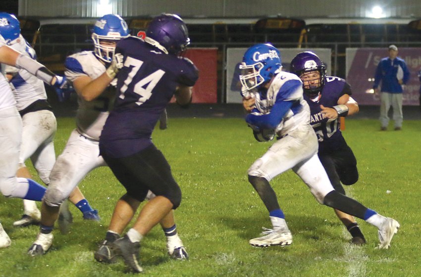 Litchfield's Owen Baugher (#50) tries to bring down Greenville running back Nathan Grull during the Panthers' home game on Friday, Sept. 23. Two late touchdowns by Greenville resulted in a 41-12 victory by the Comets, who led 27-12 at halftime.