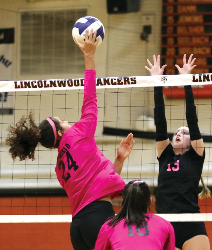 Haelee Damm (#13) and the rest of Lincolnwood&rsquo;s front line caused all kinds of problems for Gina Painter (#24) and the Litchfield hitters as the Lancers held the visiting Panthers to just six kills on the night in a two-set win at the Woodshed in Raymond.