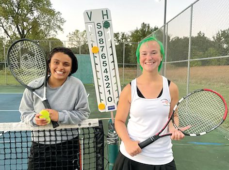 Tunisian foreign exchange student Meriem Bizid and doubles partner Melissa Bell scored a 10-7 win in the number three doubles match on Monday, Sept. 26 in Hillsboro, helping the Toppers to a 7-2 victory over Vandalia.