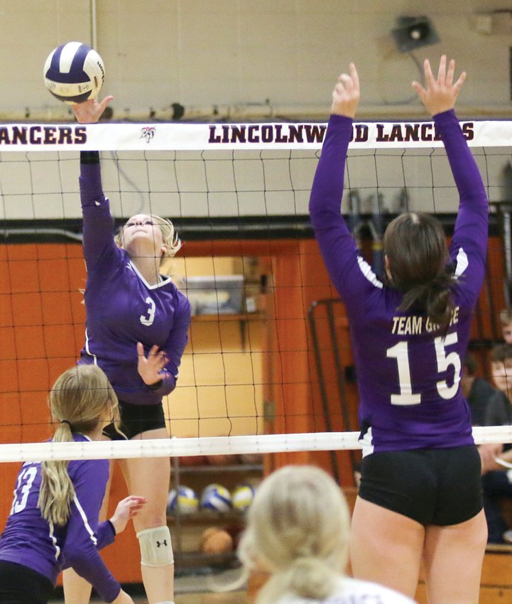 Lincolnwood&rsquo;s Tessa Funderburk (#3) attacks the Hillsboro blockers, led by Sophia Blankenship (#15) during the Lancers&rsquo; two-set win over the Toppers on Monday, Oct. 3, in Raymond.