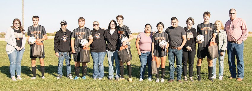 The Lincolnwood/Nokomis/Morrisonville/Pawnee soccer celebrated its five seniors on Thursday, Oct. 6, prior to their game against Williamsville at Terry Todt Field in Raymond. From the left are Braden Whalen, with mom Angie Whalen; Wyatt Kistner with parents Larry Kistner and Lynda Harden; Logan Farrar, with mom Laura Farrar; Yasmin Carrillo, with parents Maria and Fredy Carrillo; and Elijah Aumann, with parents Jane Aumann and Kurt and Kelly Aumann.