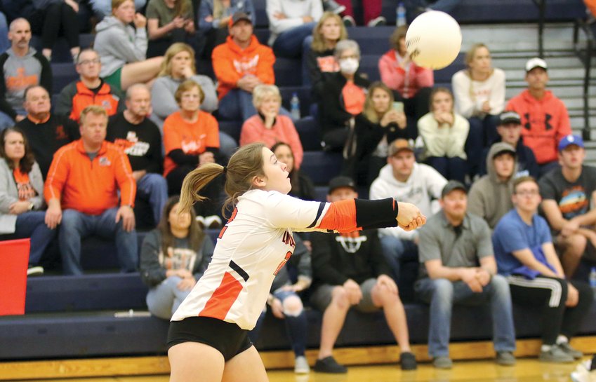 In front of a large crowd of supporters in orange and black, Lincolnwood's Taryn Millburg makes a pass during the Lancers' sectional semifinal game against Mendon Unity on Monday, Oct. 31, in White Hall. Despite their best efforts, the Lancers fell to the Mustangs 25-19, 25-19 to end their season with a record of 34-4.