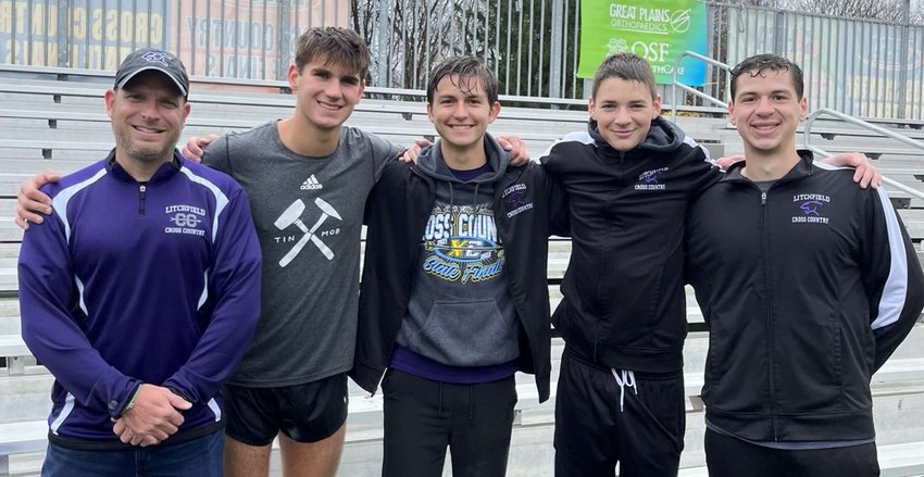 While Camden Quarton was the only Litchfield runner on the soggy course at Detweiller Park on Saturday, Nov. 6, Quarton&rsquo;s coaches and teammates braved the wet weather in Peoria to cheer on the junior standout in his second state trip. From the left are Coach Jeremy Palmer, Quarton, Sam Horn, Kenny Traylor and Assistant Coach Vincent Fanelli.