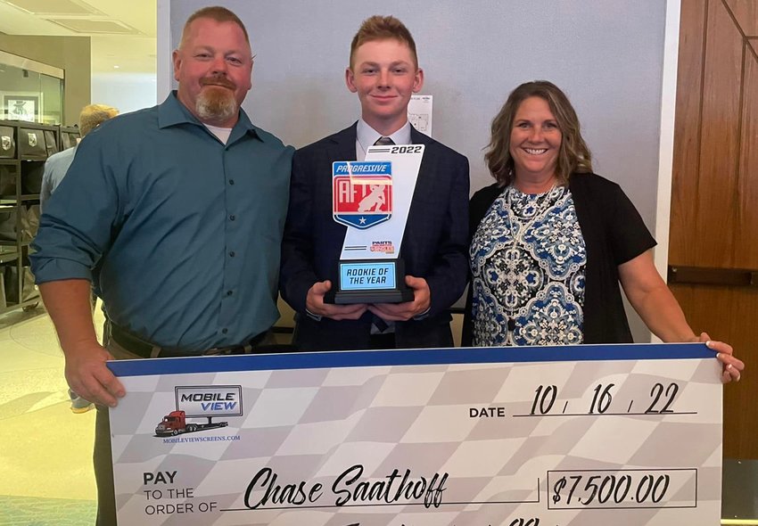 Chase Saathoff, pictured with his parents Mike and Bobbi Saathoff, picked up rookie of the year honors and the $7,500 that accompanied it after a stellar debut season in the Parts Unlimited American Flat Track Singles class. Saathoff scored two podium finishes, six top fives and 14 top 10s in 16 races in the flat track motorcycle series in 2022.