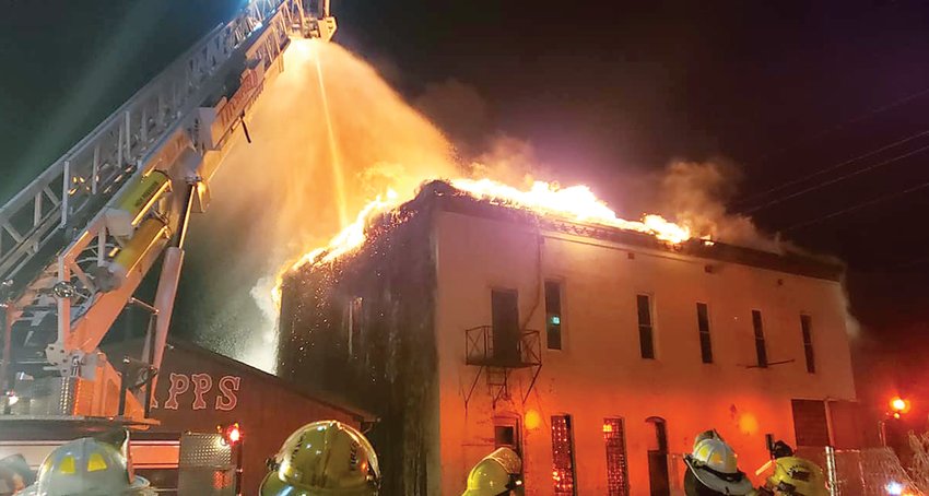 Firefighters attack a downtown Litchfield fire with ladder trucks on Friday, Nov. 11.  Ladders from Carlinville and Witt were also in service battling the blaze.