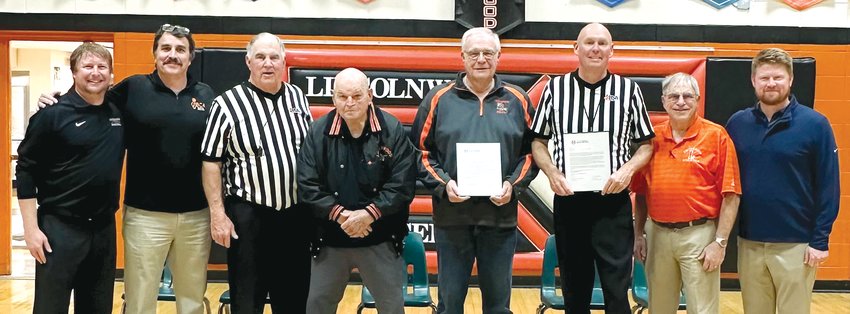 In front of the Lincolnwood faithful at the Lancer basketball preview night on Friday, Nov. 11, Mike Meisner and Alan Poggenpohl, both of Raymond, were told they will be part of the newest class of the Illinois Basketball Coaches Association Hall of Fame. Pictured above are Matt Millburg, Steve Dilley, Denny Held, Wayne Angle, Mike Meisner, Alan Poggenpohl, Verne Pinkston and Blake Lucas. Held, Angle and Pinkston are also enshrined in the IBCA Hall of Fame.
