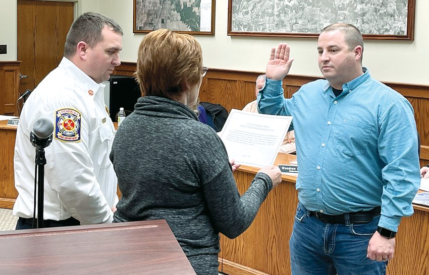 Edward Quinn, right, was sworn in as a volunteer firefighter for the City of Litchfield on Thursday, Jan. 5, by City Clerk Carol Burke and Interim Fire Chief Adam Pennock.