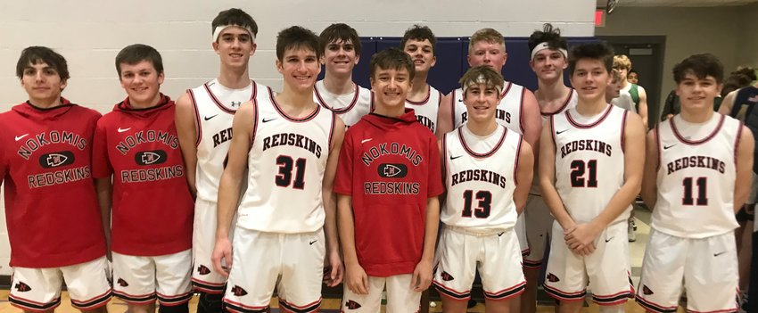 Even with a COVID-shortened 2020-21 season, the Nokomis boys basketball program needed less than five years to reach win number 1,600 after notching win number 1,500 on Feb. 23, 2018. The Redskins hit the next milestone on Tuesday, Jan. 17, at the Rick McGraw Memorial Invitational in Litchfield with a 60-47 win over Father McGivney in their pool play finale. Team members, from the left, are Saint Newman, Brody Steele, Reece Lohman, Elijah Aumann, Ian Keller, Maddux Himes, Drake Taylor, Mason Stauder, Ryan Eisenbarth, Nolan Himes, Kennedy DeWerff and Kam Coss.