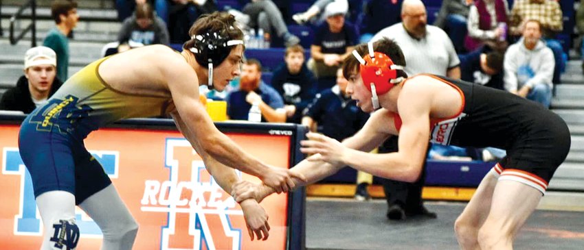 Hillsboro's Treyton Kuhl (right) locks up with Luke Bliven of Quincy Notre Dame during the Rocket Invitational in Rochester on Saturday, Jan. 21. Kuhl would go on to finish fifth at 138-pounds, one of 10 toppers to earn a spot on the podium in Rochester.