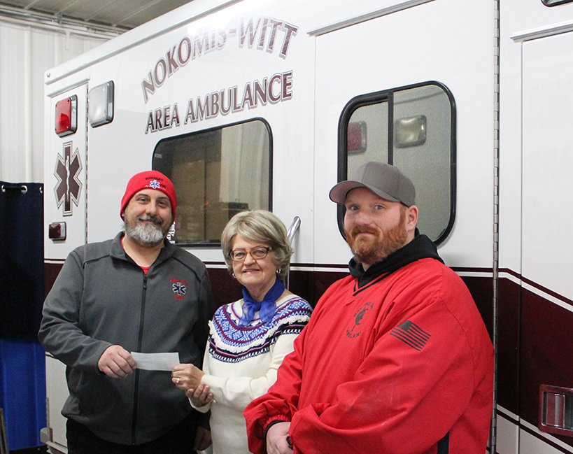 Above, Nokomis Chamber of Commerce President Judy Rupert (center) presents a $500 donation to Nokomis-Witt Area Ambulance Service Chief Travis Hocq (left) and Assistant Chief Tyler Batty (right).