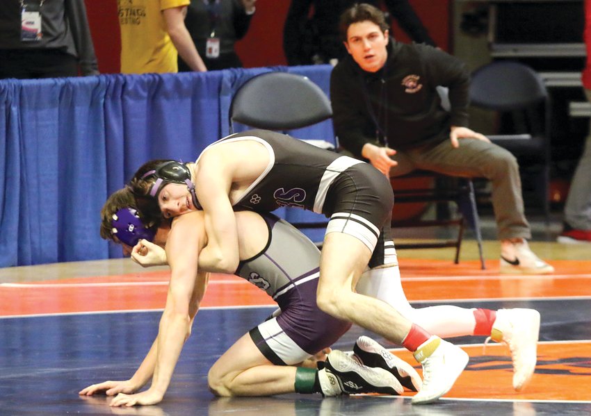 With his brother Carter in his corner, Litchfield's Alex Powell works to break down Landon Dooley of Wilmington during their 113-pound preliminary match at the IHSA State Finals on Thursday, Feb. 16, in Champaign. Powell went on to win the match 9-2 en route to a second straight sixth place finish at the state tournament.