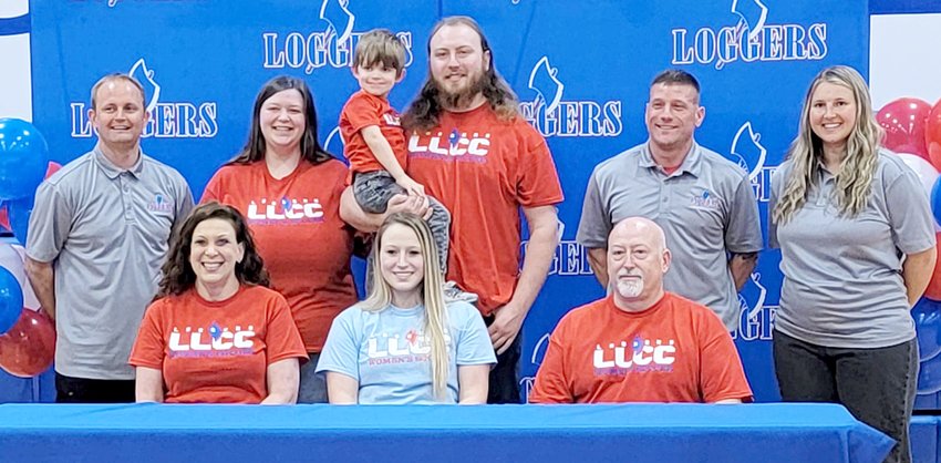 After being told that she most likely wouldn&rsquo;t be able to pursue a nursing education and play soccer in college, Hillsboro senior Avery Walden signed with Lincoln Land Community College on Monday, Feb. 27, to do just that. In front, from the left, are Avery Walden (center) and her parents Lisa and Kris Walden. Behind them are LLCC Head Coach David Meyer, Megan Jewell, her son Oliver Hitchcock, Ashton Walden, LLCC Assistant Coach Ray Bishop and LLCC Assistant Coach/Keeper Coach Maddison Butcher.