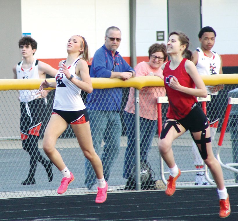 Hilsboro's Layne Rupert (left) was second in the 400 meters, while Nokomis' Irene Vandenbergh was first at the quad meet in Gillespie on Tuesday, April 4. Both ran their best times of the year in the race, with Vandenbergh running a 1:05.58 and Rupert running a 1:06.12.