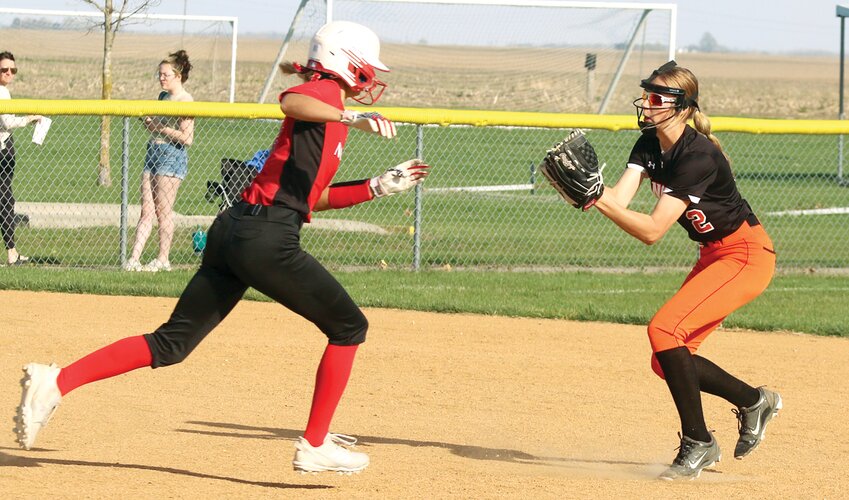 Nokomis' Hailey Engelman tries to avoid the tag from Lincolnwood shortstop Avery Pope during the MSM Conference match-up between the two rivals on Thursday, April 13. Nokomis scored four runs in the top of the fourth inning to break open the game, en route to an 8-2 win over the Lady Lancers in Raymond.