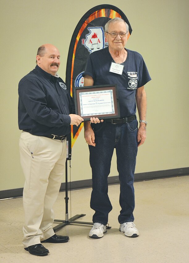 Richard Hewitt, at right, was presented an award as part of his outstanding and dedicated role as a longtime fire investigator at the Illinois Chapter of the International Association of Arson Investigators Conference held Monday, April 10, at the Caseyville Community Center.