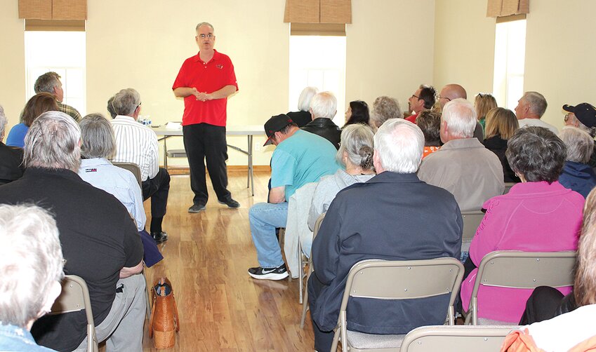 Historical author Tom Emery (standing) spoke to a crowded room during an informal lecture held at the Challacombe House in Hillsboro on Sunday, April 16. The educational event was hosted by the Historical Society of Montgomery County in celebration of Hillsboro&rsquo;s bicentennial year.