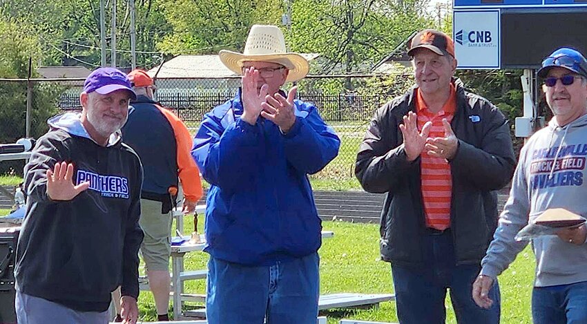 Litchfield High School boys track coach Dan Newkirk (left) was honored for his 33 years of dedication to the athletes of Litchfield High School and the sport of track during the Jokisch-Grandone Invitational in Carlinville on Saturday, April 29. Pictured with Newkirk, who will be retiring at the end of the year, are the event's namesakes, Dave Jokisch and Jerry Grandone, and former long-time Carlinville track coach Ken Garrison.