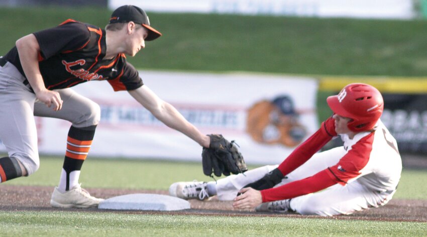 Nokomis' Ian Keller tries to avoid the tag from Lincolnwood's Gabe Armentrout during the Redskins' match-up with the Lancers on Wednesday, April 26, at GCS Ballpark in Sauget. Keller was safe on the play, one of two stolen bases he had in the Redskins' 10-5 win over the Lancers.