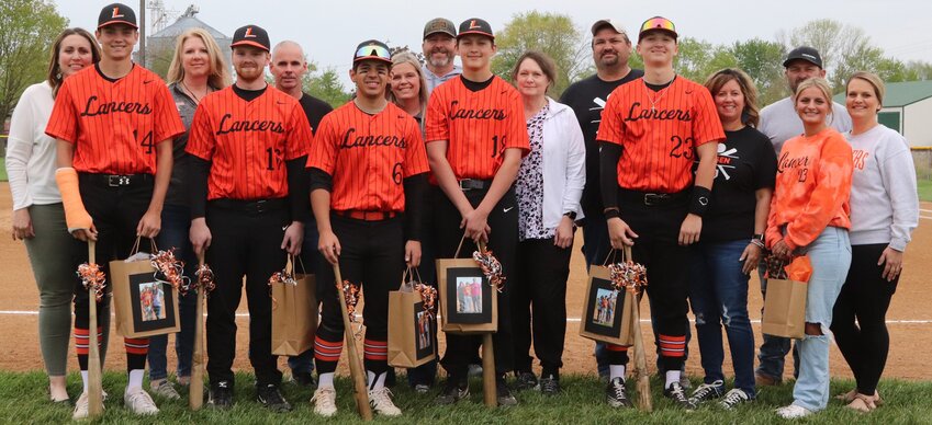 The senior members of the Lincolnwood-Morrisonville baseball team were honored prior to the Lancers 15-4 win over Ramsey on Thursday, April 27. From the left are Braden Whalen, with mom Angie Whalen; Connor Seelbach, with parents Cindy and Steve Seelbach; Zake Guzman, with mom Jessica Guzman; Nate Brockmeyer, with parents Korey and Dana Brockmeyer; Carsen Bethard, with parents Steve and Jayne Bethard; and Jhia Walker, with parents Jeremy and Amanda Walker.