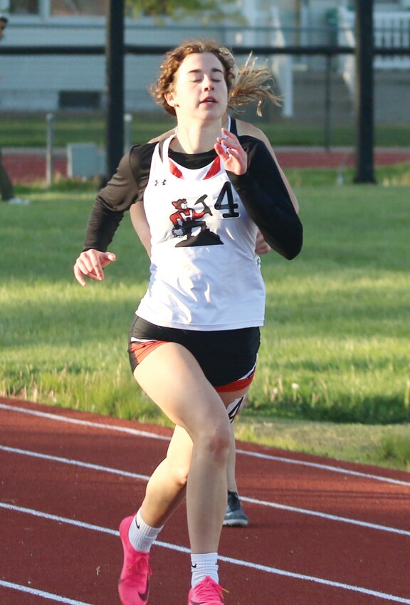 Hillsboro's Hanna Hughes finishes off her second place run in the 300 meter hurdles at the South Central Conference Championships in Staunton on Tuesday, May 2. Hughes also finished third in the long jump and was the conference champion in the triple jump to account for 24 of her team's 68 points.
