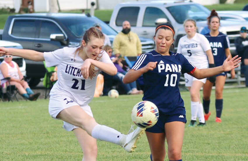 Litchfield's Ava Ballard (#21) clears a ball away from forward Jenna Hadowsky of Pana during the second half of the regional battle between two of the South Central Conference's Lady Panthers. Ballard, the Litchfield defense and goalkeeper Olivia Mitchell held off hard-charging attack by Hadowsky and company to beat Pana 4-1 and advance to Tuesday's sectional semifinal against Southwestern.