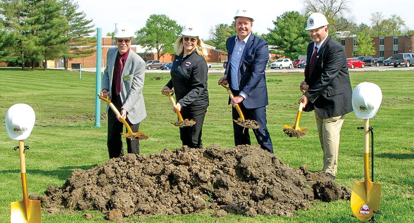 President Gregory J. Meyer, Blackburn Trustee Jennifer Shelby, Illinois Deputy Governor Andy Manar and Interim Athletic Director and Head Baseball Coach Mike Neal officially break ground on the site of a new indoor athletic facility with ceremonial hard hats and shovels during an event at Blackburn College.