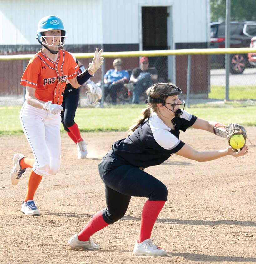 Under the watchful eye of New Berlin base runner Riley Holloway, Grace DeWerff snags a line drive at short to help Nokomis get out of the third inning of their game against the Pretzels on May 9. Nokomis went on to win the game 5-3 on senior night for the Lady Redskins.