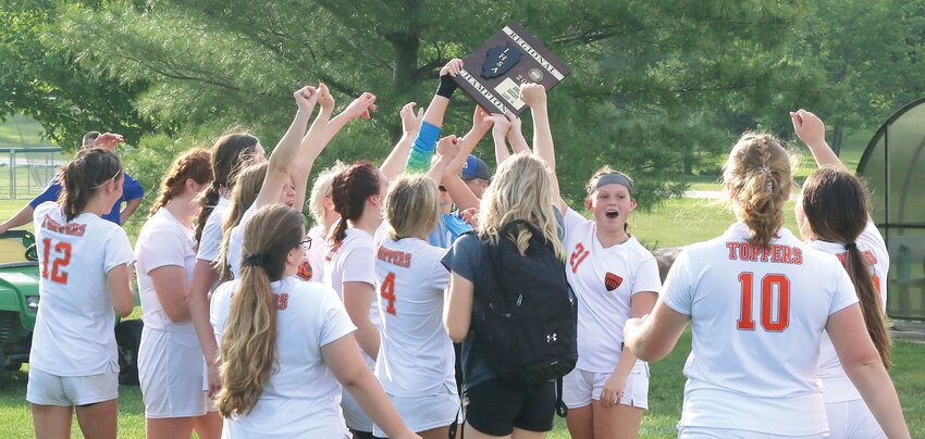 Members of the Hillsboro High School soccer team celebrate with their regional championship trophy after defeating Litchfield 9-1 in Greenville on Friday, May 12. The Lady Hiltoppers will now play Pleasant Plains on Tuesday, May 16, at 6:30 p.m. at the Riverton Sectional.