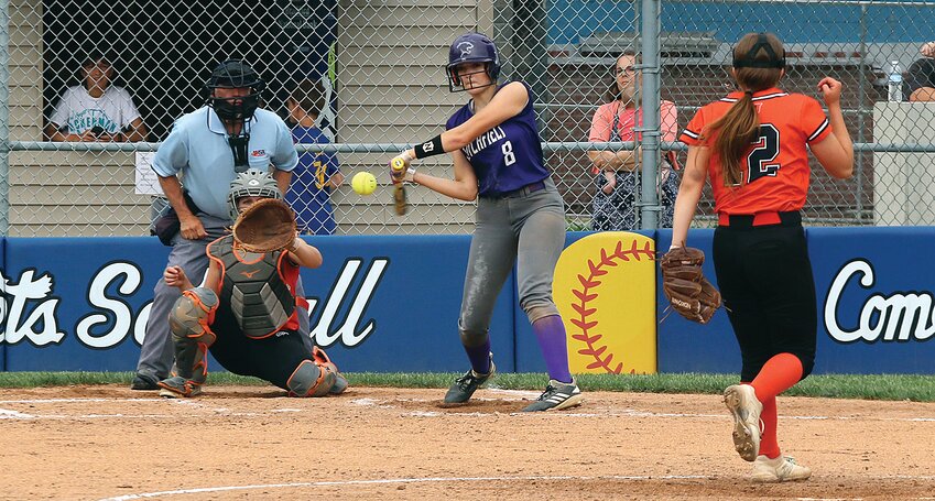 Litchfield's Emma Walch takes a cut at Anika Camp's offering from the circle during the regional quarterfinal game between the Purple Panthers and Hillsboro on Monday, May 15. Walch, one of four seniors on the Litchfield squad caught the pitch square and sent it over the fence for the final two runs in the Panthers' 7-3 victory over the Lady Hiltoppers in Greenville.