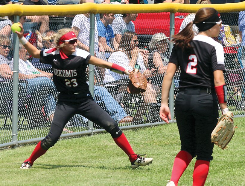 Nokomis' Addison Dangbar prepares to make the throw back into the infield after a double to center field during the Lady Redskins' regional championship game in Carrollton on Saturday, May 20. The regional hosts used a five-run sixth inning to put the game out of reach as Carrollton defeated Nokomis 10-2 to take the title.
