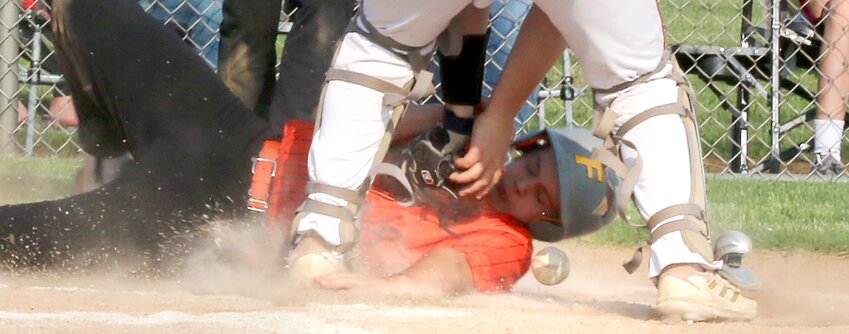 Jhude Walker jarred the ball loose as he slid into home for one of Lincolnwood's runs in their seven-run fourth inning on Thursday, May 18, at the Nokomis Regional. The Lancers used the big inning to break a 1-1 tie with Nokomis, en route to a 10-3 regional semifinal win over the Redskins.