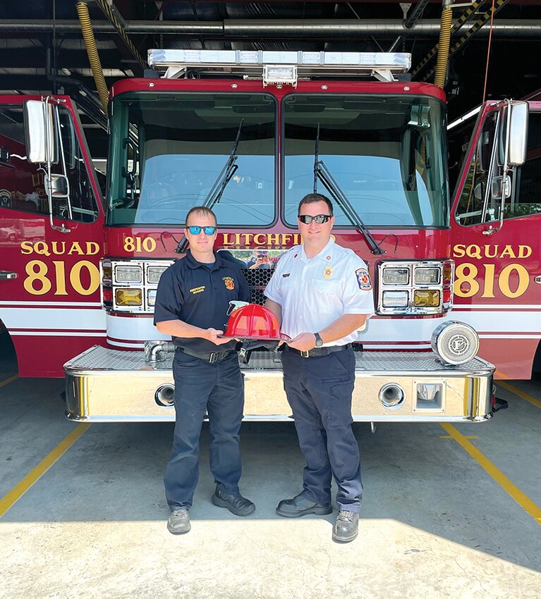 Following more than a decade of service to the Litchfield Fire Department, David Rogers was promoted to the position of captain on Tuesday, May 23. From the left are Rogers and Fire Chief Adam Pennock (right).