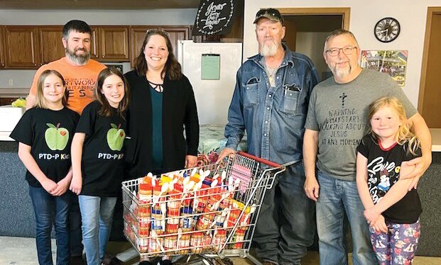 The Raymond Baptist Church made a donation of 108 jars of peanut butter to Project Third Day-Panhandle on Wednesday, April 26. From the left are Project Third Day volunteers Jake and Amy Barnes and their daughters Kaylynn and Lily, Harold Cantrall, Pastor Ron Butler and Tatum Buchanan.
