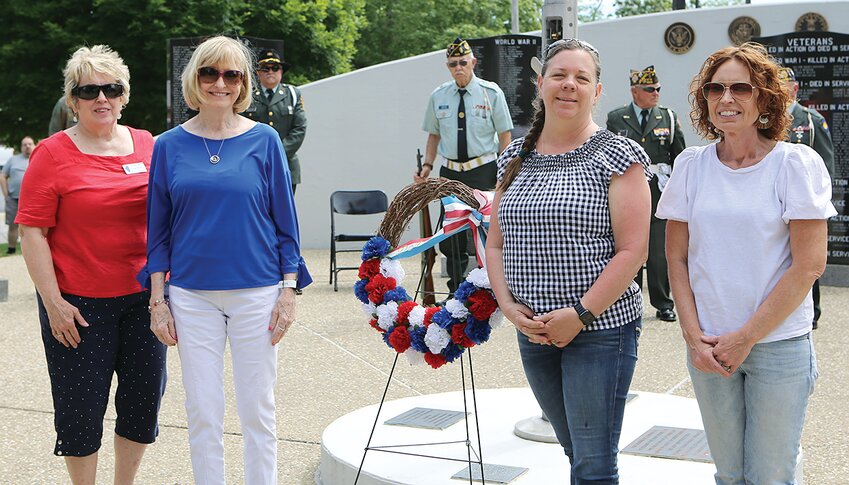 Members of the Christiana Tillson Chapter of the Daughters of the American Revolution, from the left Chris Carver, Patricia Whitworth, Kendra Wright and Melanie Sherer, present the memorial wreath.