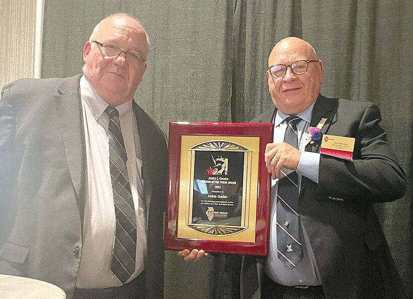 Illinois Press Association President and CEO Don Craven, left, presents the James C. Craven Freedom of the Press Award to Journal-News owner John Galer.