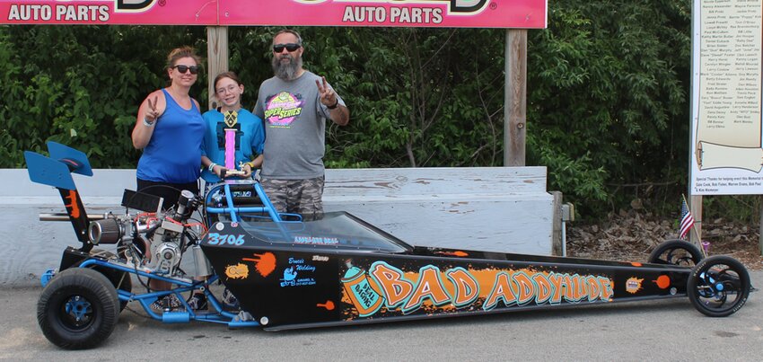 Addy Beal, pictured with her parents Angie and Andy Beal of Farmersville, picked up a second place finish in the Jr. Dragster class on Sunday, June 4, at Coles County Dragway in Charleston. Beal also did well the night before, winning the Ray Evans Consolation Bracket.