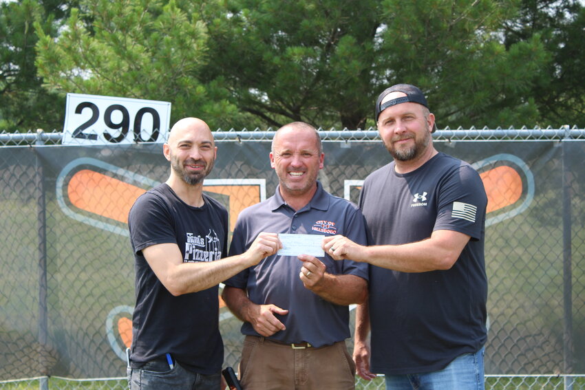 Vitale Foods presented a check for $7,200 to Hillsboro&rsquo;s recreational baseball, softball and T-ball teams. The funds were raised through a season-long fundraiser where the youth teams sold Vitale Foods&rsquo; frozen pizzas. From the left are Vince Vitale, Sports Administrator Bill Christian and Wayne Adams.
