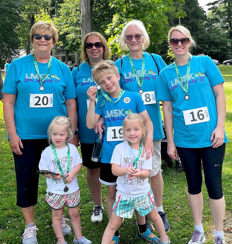 Team members pictured above, from the left are Tammy Johnson of Nokomis, Jill Wells, Colton Wells, Mary Ann Smith of Bloomington and Morgan Johnson. In front are little miracle twins Taylor Johnson, at left, and Quinn Johnson, at right.