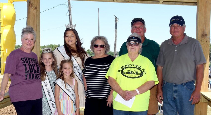 Helping to dedicate the new grandstand were Missy Dean, Junior Miss Nataleigh Jackson, Little Miss Karsyn Jones, Miss Montgomery County Fair Alexis Lessman, Debbie Compton, Montgomery County Fair Board President Mary Bishop, John Eickhoff and Terry Leitschuh.